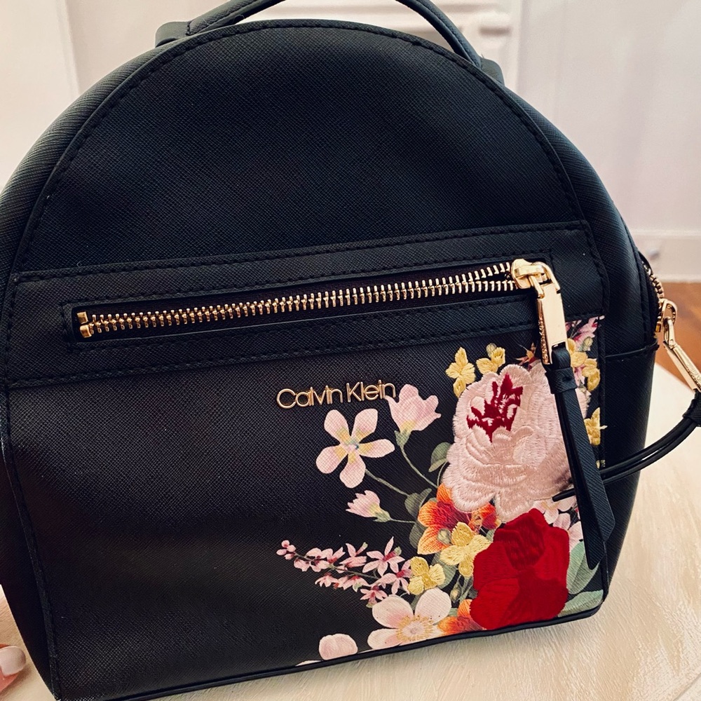 Calvin Klein Mercy Floral
Leather Backpack- like new condition